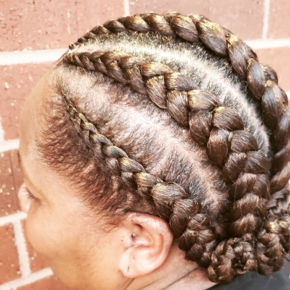 Feed-in cornrows gathered into a polished bun